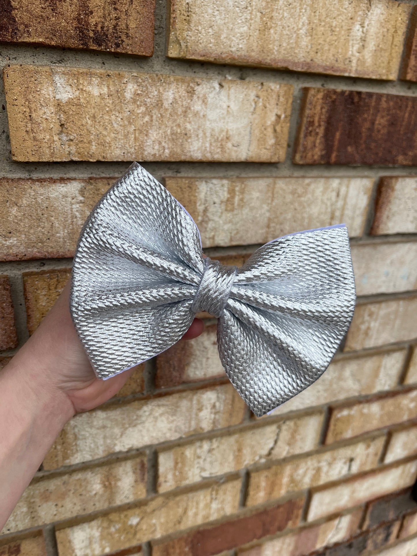 Silver Metallic Clip In Bow