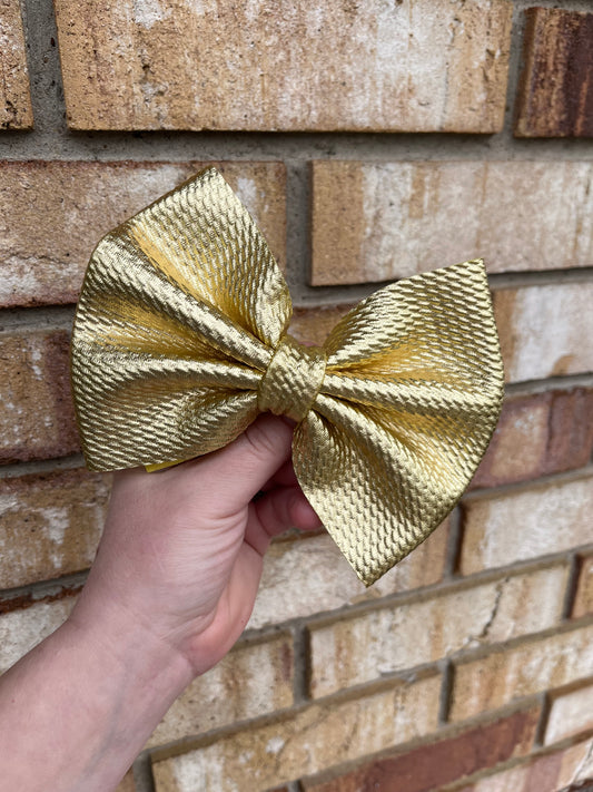 Metallic ￼Gold Clip In Bow